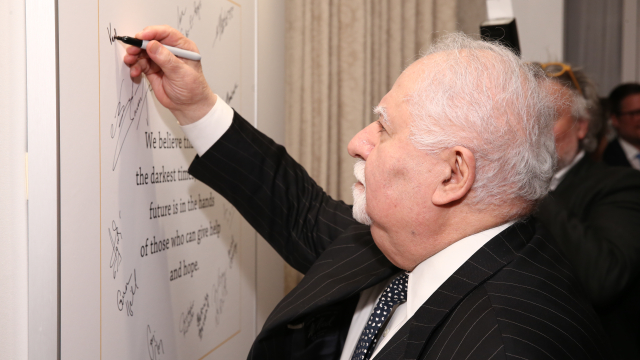 Vartan Gregorian signing pledge wall